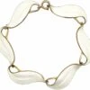 1950s Silver & White Enamel Leaves Bracelet By Finn Jensen 1 1950s Silver & White Enamel Leaves Bracelet By Finn Jensen -Antique Jewellery Company 8be62c57 vintage white enamel bracelet1 scaled 1