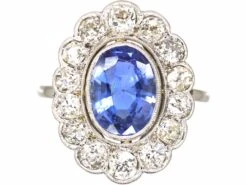 Early 20th Century Platinum, Large Sapphire & Diamond Oval Cluster Ring