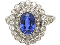 Early 20th Century Platinum, Sapphire & Diamond Oval Cluster Ring With Diamond Set Shoulders -Antique Jewellery Company DSC09041 scaled 1